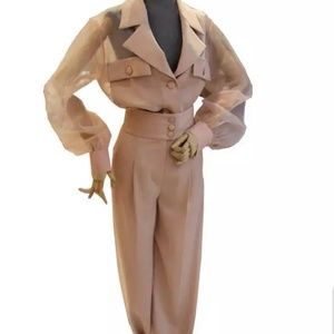 Cropped pants and sheer blouse.